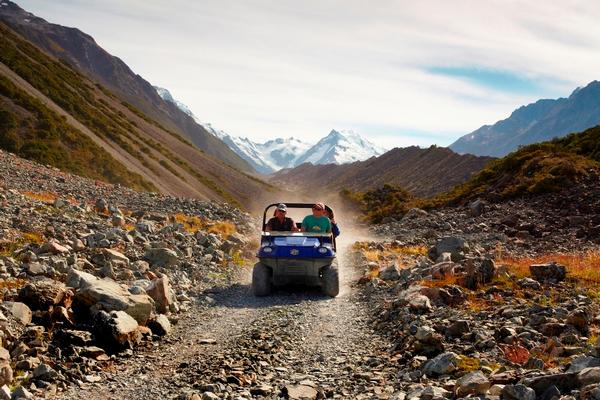 Argo tour guide Graeme Slatter driving alongside the Tasman Glacier Moraine Wall